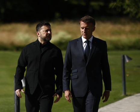 French president Emmanuel Macron, right, walks with Ukrainian president Volodymyr Zelenskyy at the Hotel Royal for the G7 Summit in Evian-les-Bains, France.