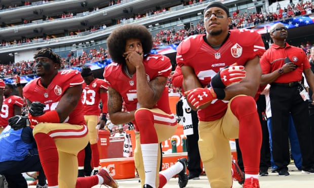 The San Francisco 49ers ‘take the knee’ during the national anthem, as a statement against racial injustice