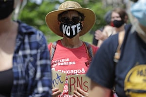 Chicago, US A protester attends a Health Care Justice demonstration at which nurses, health care workers, and community activists united to protest against racism in the healthcare industry and demand one, excellent standard of care for all