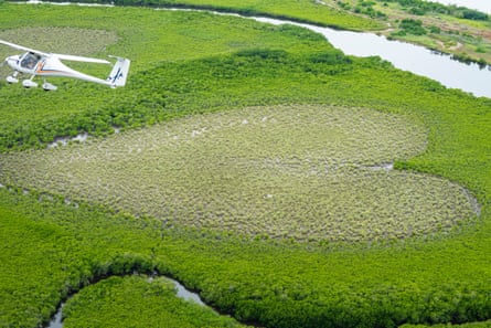 Günter Gerant flying over the Heart of Voh, showing tourists the symbol of love by air