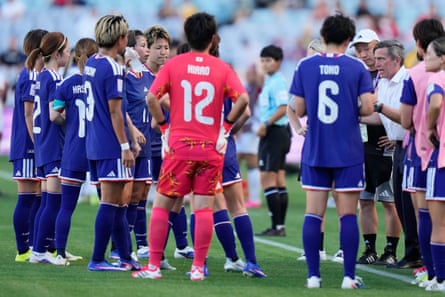 Japan's coach Nils Nielsen talks to nan squad successful their quarter-final against nan Philippines.