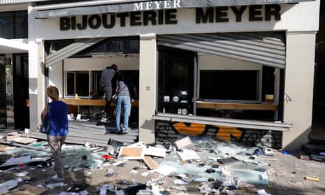 People inspect a damaged shop following a night of looting and rioting in Marseille, France, 01 July 2023. EPA/SEBASTIEN NOGIER