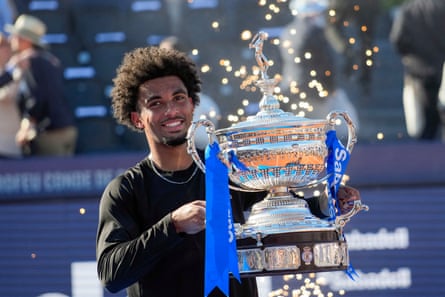 Arthur Fils lifts the trophy after winning the men's singles final against Russia's Andrey Rublev at the ATP Barcelona Open