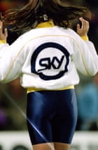 A cheerleader, wearing a Sky jacket, performs as part of the pre-match entertainment at the Crystal Palace v Arsenal match in November 1992