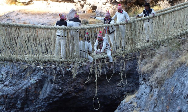 Members of the Huinchiri community rebuild the Qeswachaka bridge using traditional weaving techniques in Canas province.