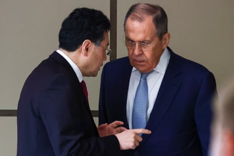 Russian Foreign Minister Sergei Lavrov, right, and Chinese Foreign Minister Qin Gang on the sidelines of a ministerial meeting in Samarkand, Uzbekistan.