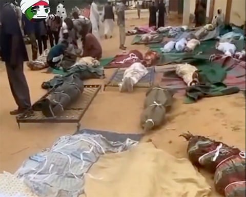 Bodies on the floor covered and wrapped in blankets