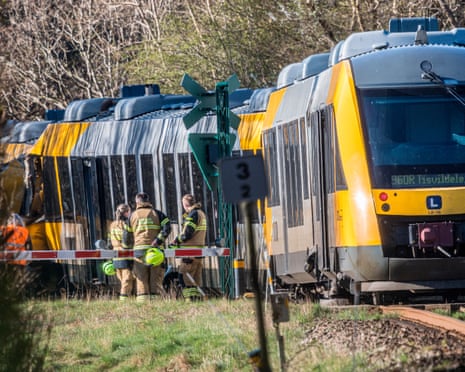 Officials and emergency responders inspect the accident scene after two trains collided between Hilleroed and Kagerup at Isteroedvejen, Denmark.