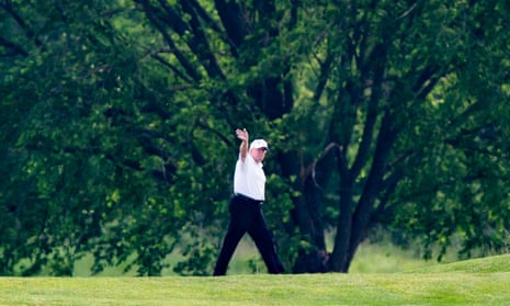 Donald Trump waves as he plays golf in Sterling, Virginia, on 23 May. 
