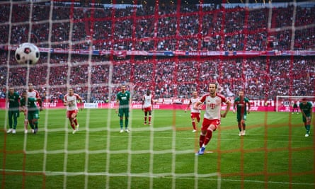 Harry Kane scores from the penalty spot on his home debut for Bayern Munich.
