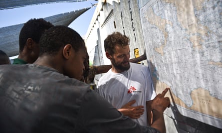 Rescued migrants show MSF staff their departure point.
