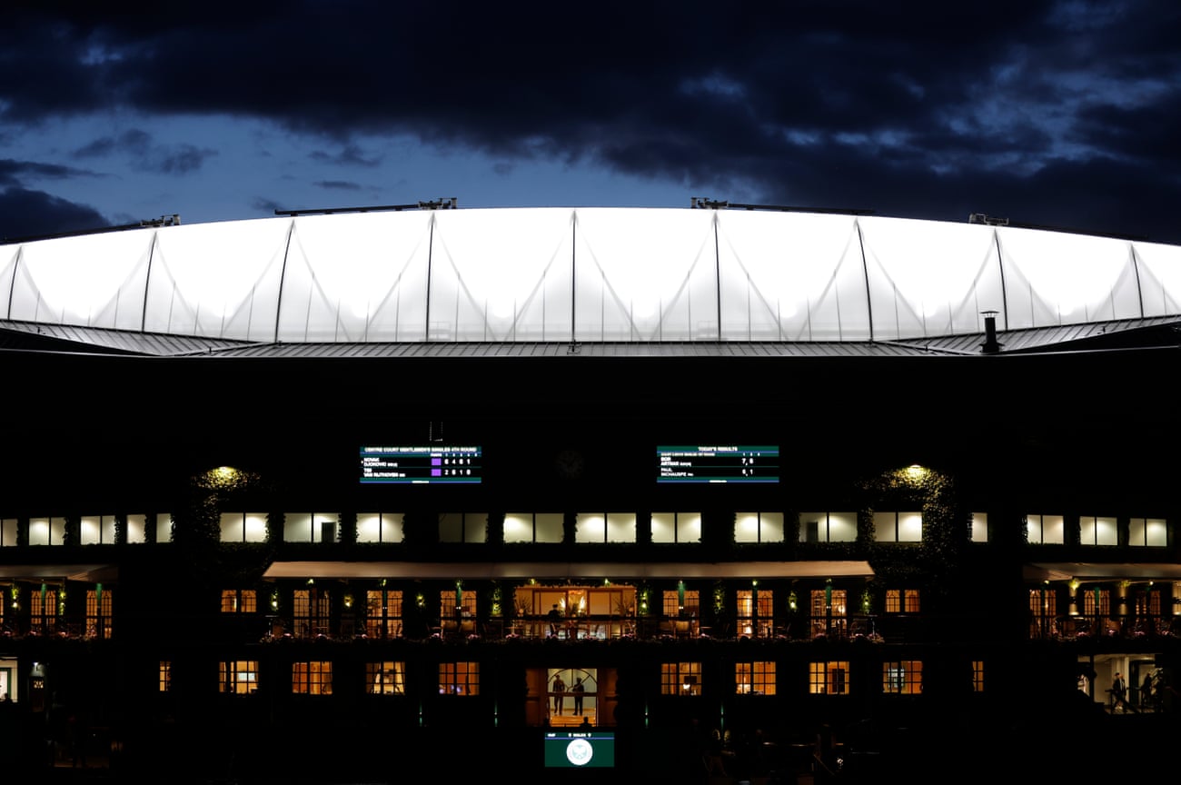 Tom Jenkins’ best shots of Wimbledon 2022 – in pictures | Wimbledon 2022 16 Darkness falls over the lit up roof on Centre Court as Novak Djokovic plays Tim Van Rijthoven.