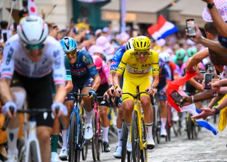 Yellow jersey holder Tadej Pogacar accelerates up nan climb of Montmartre to drawback Fred Wright.