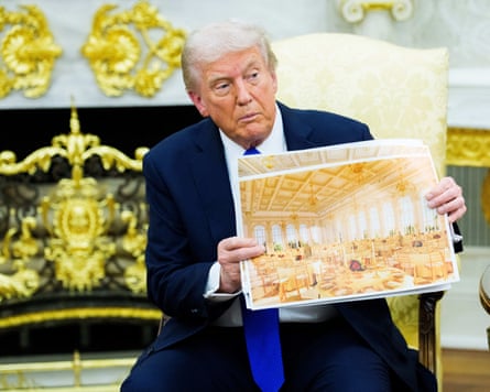 Trump holds up a plan of the ballroom in the Oval Office (Pic: Aaron Schwartz/Pool via CNP)