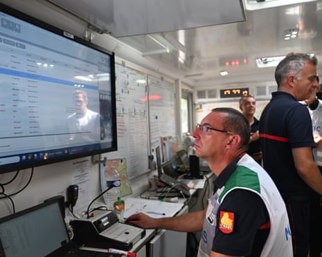 Fire personnel plot out strategies to fight fires in a command center near Claouey, during wildfires in southwestern France.