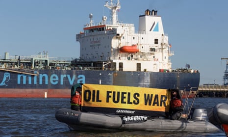 Activists protest near oil tanker Minerva Virgo docked at Bayonne, New Jersey.