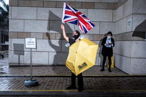 Hong Kong, China: Pro-democracy activist Alexandra Wong demonstrates outside West Kowloon court where 47 pro-democracy defendants appear charged with conspiracy to commit subversion