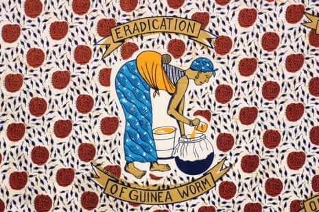 A cloth from Togo depicting a woman filtering water to prevent Guinea worm
