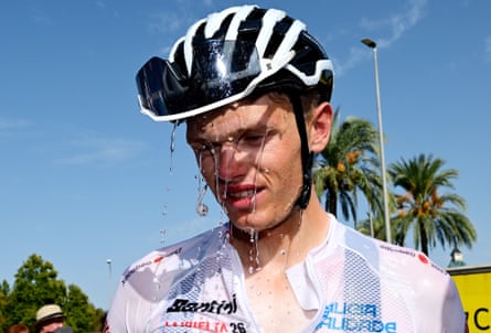 Oscar Onley of the Netcompany Ineos Cycling team cools down after stage 15 was cut short because of extreme heat.
