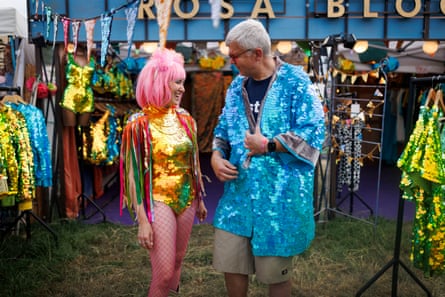 Adrian Chiles tries on party outfits at Glastonbury 2025. Saturday 28 June 2025