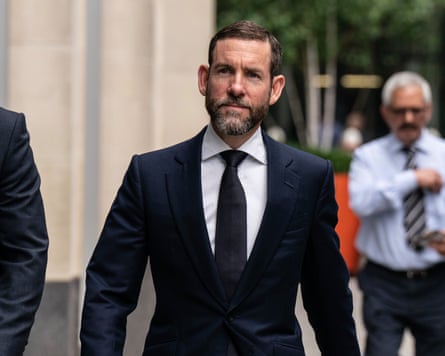 Lex Greensill walking on the street.