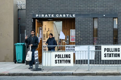 Man and woman leave a polling station