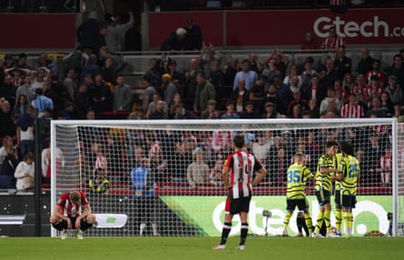 Brentford’s Nathan Collins (left) appears dejected after their League Cup exit to Arsenal.