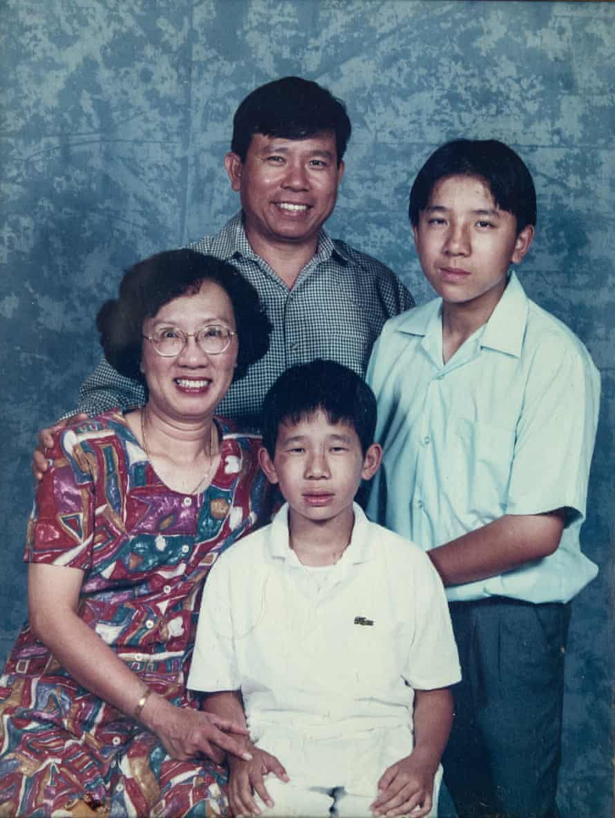 A family photo from several years ago shows, (Left)- Quynh Trang Truong, (Centre Back) Chau Van Kham and their children, (Centre) Dennis Chau and (left) Daniel Chau .