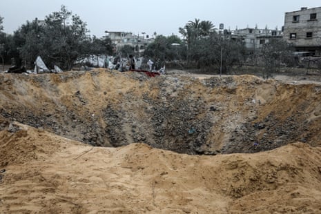 A very large crater in the ground is pictured, after an overnight Israeli attack on Rafah killed 11 people, including five children.