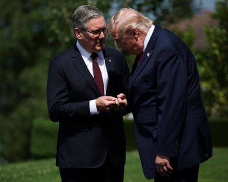 Starmer and Trump dark suits lean toward each other in conversation outdoors on a lawn