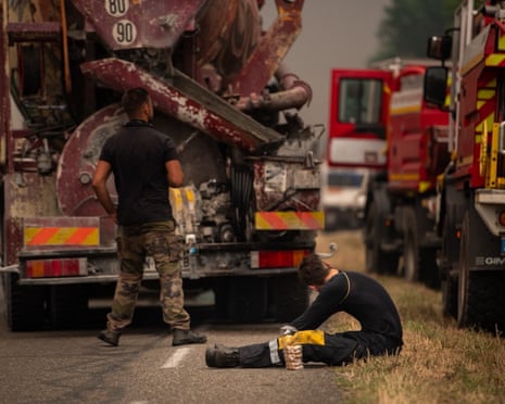 Firefighters taking a break in a forest between Cestas and Marcheprime, southwest France.