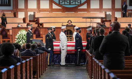 The casket is prepared for movement at the end of a funeral service for John Lewis in Atlanta, Georgia, on 30 July.