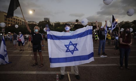 People take part in a protest against Israel’s plan to annex parts of the West Bank on Tuesday.