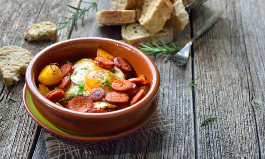 Spicy chorizo sausage with fried egg and baby potatoes.