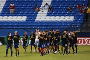 The entire FC Dallas team and staff wave fans after it was announced that the game was postponed between FC Dallas and Colorado Rapids in Frisco, Texas, on 26 August
