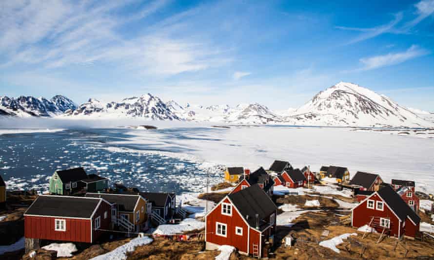 The frozen sea off Greenland, a few houses in the foreground