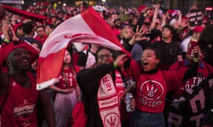 Toronto Raptors fans sing the national anthem before the opening game of the NBA finals