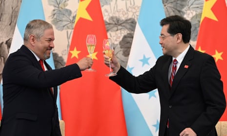 Honduras foreign minister Eduardo Enrique Reina Garcia, left, and Chinese foreign minister Qin Gang raise a toast following the establishment of diplomatic relations between the two countries,