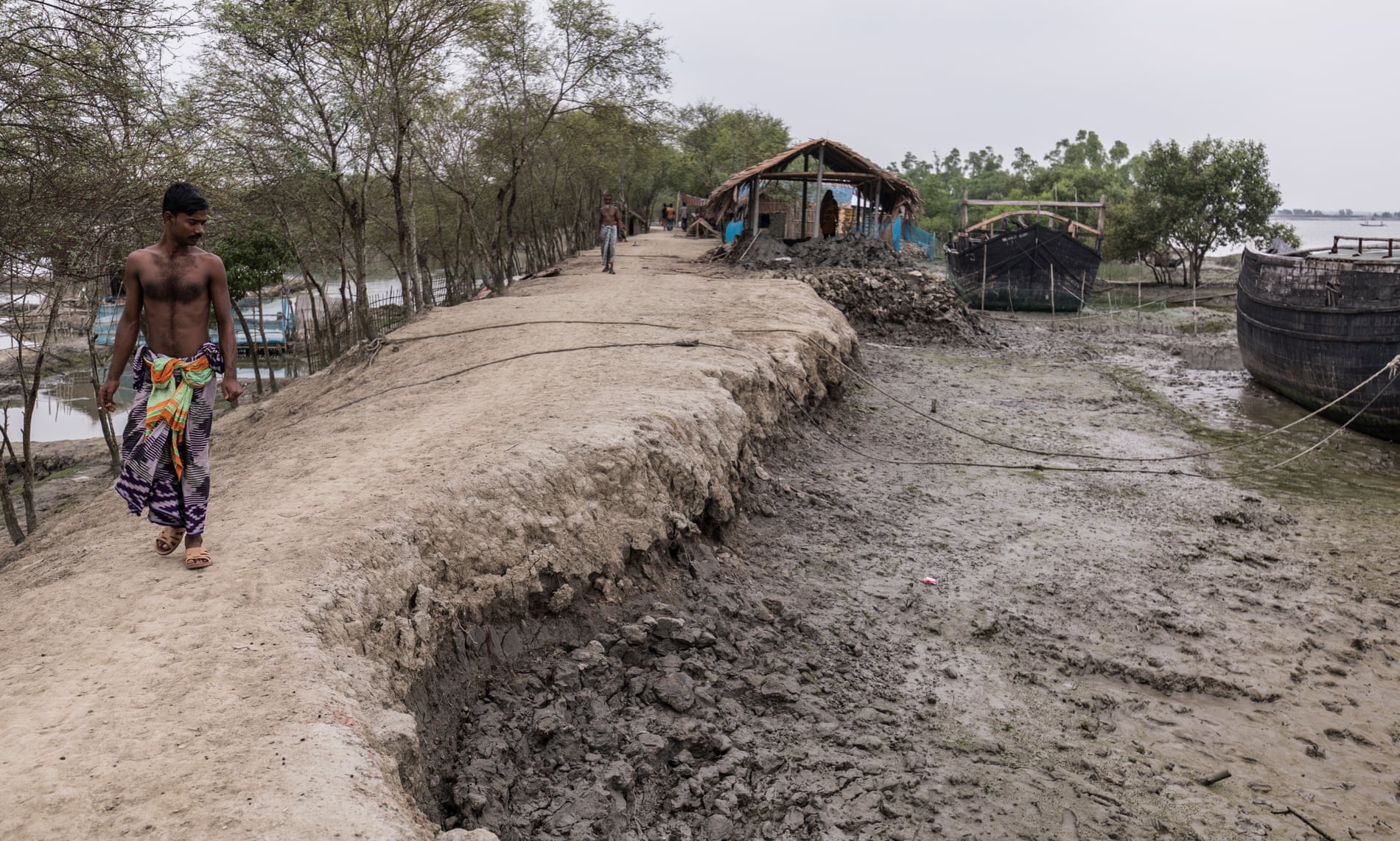 With every high tide, the embankments that protect villages and farmland around Shymnagar in southern Bangladesh are further eroded
