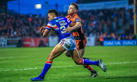 Cory Aston (right) puts in a tackle during his try-scoring debut for Castleford against Wakefield Trinity on 18 April.