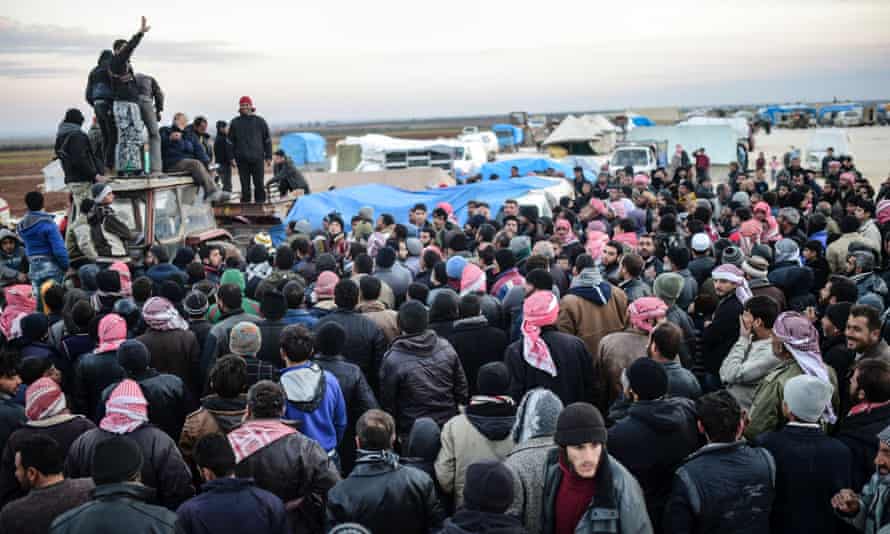 A crowd of  Syrian civilians fleeing Aleppo in Azaz on the border with Turkey.