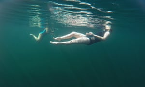 In this underwater-taken image the writer Jenny Landreth and swimmer and artist Vivienne Rickman-Poole swim in Llynnau Cwm Silyn, Snowdonia national park, Wales.