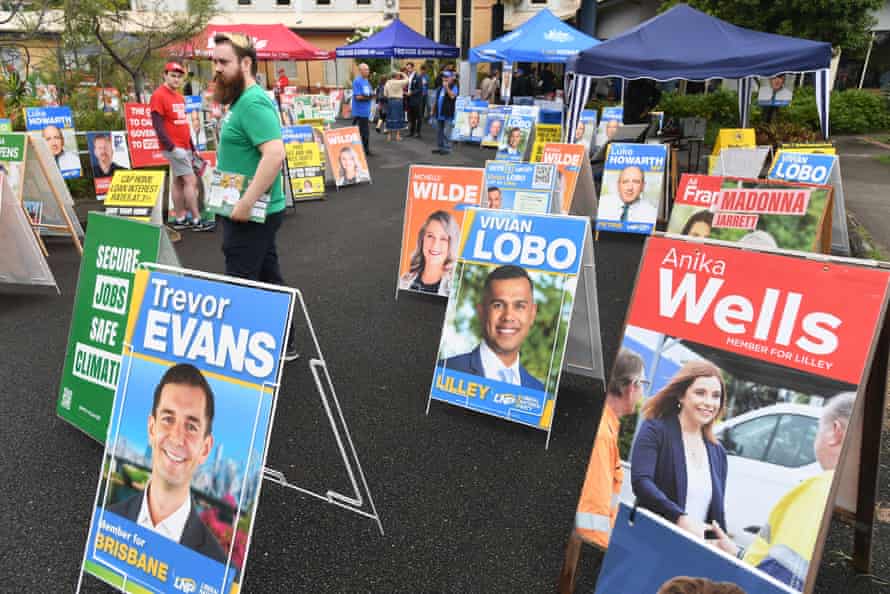 A corflute sign for Vivian Lobo (centre), the Liberal National Party candidate for the Federal seat of Lilley is seen as people turn out to vote at the pre-polling booth at the Chermside-Kedron Community Church in the federal seat of Lilley, in Brisbane, Tuesday, May 10, 2022.