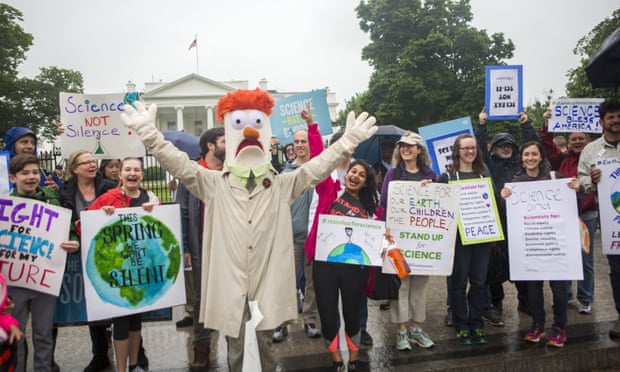 Members of the Union for Concerned Scientists pose for photographs with Muppet character Beaker in front of the White House before heading to the National Mall for the March for Science on Saturday in Washington DC.