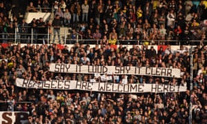 German football fans hold 'refugees welcome' banners