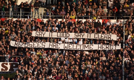 St Pauli fans unfurl a banner welcoming refugees during a match against their sellout fellow hipsters Borussia Dortmund.