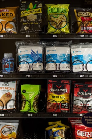 A vending machine sells hand sanitizer, gloves and masks at the Cronkite School of Mass Communication at the downtown Phoenix campus of Arizona State University.