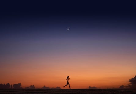 Woman jogging at sunset
