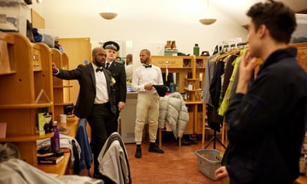 Ken Nwosu and fellow male cast members get ready inside their shared dressing room