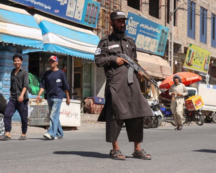 A member of Taliban security stands guard outside a mosque in Shahrak-e-Almahdi, Jebrail district of Herat province yesterday.